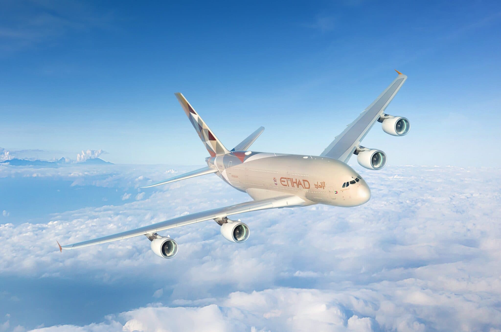 Etihad Airways passenger jet flying above the clouds