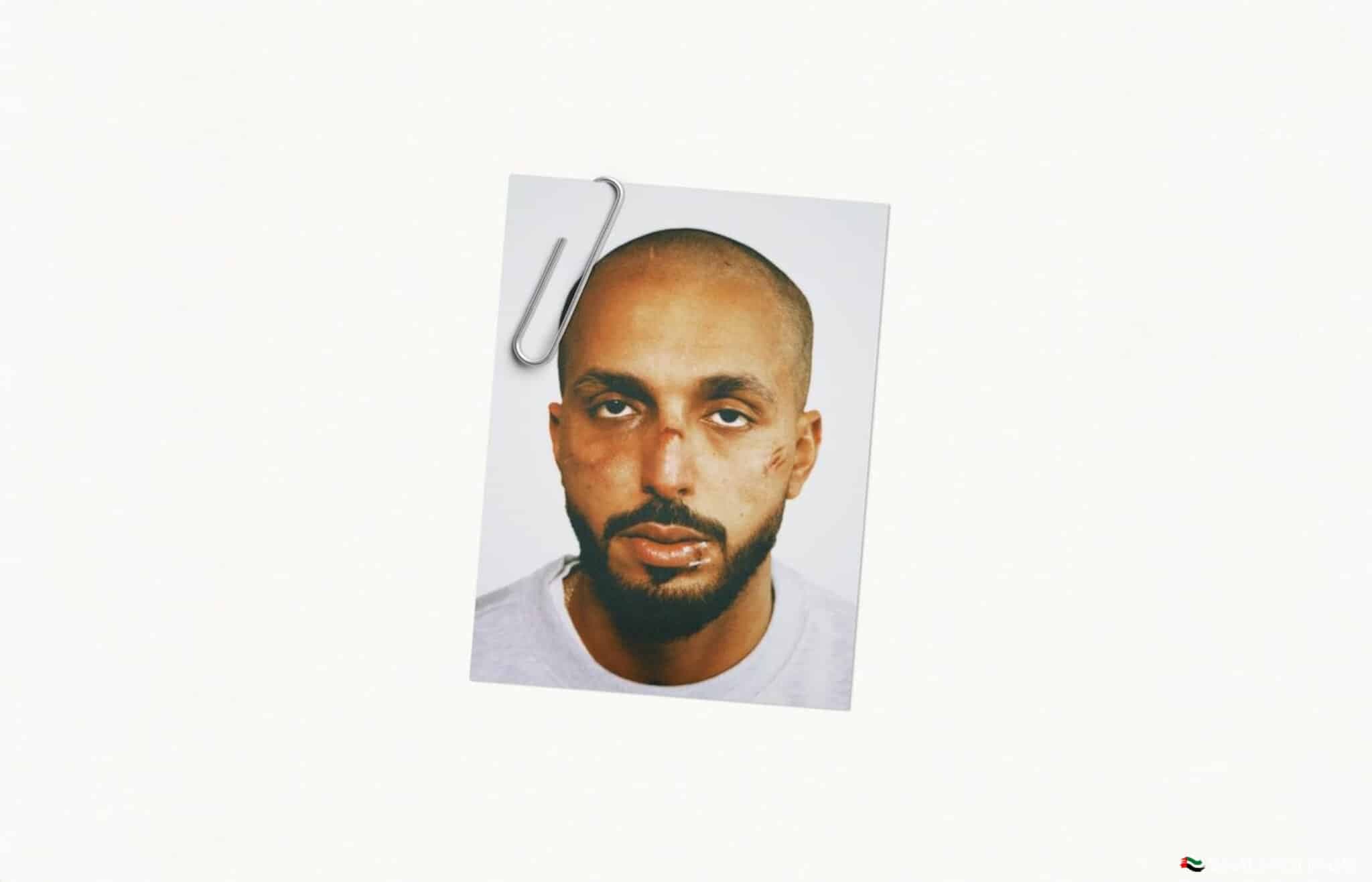 A photo of a man with a neutral expression, clipped to a white background.