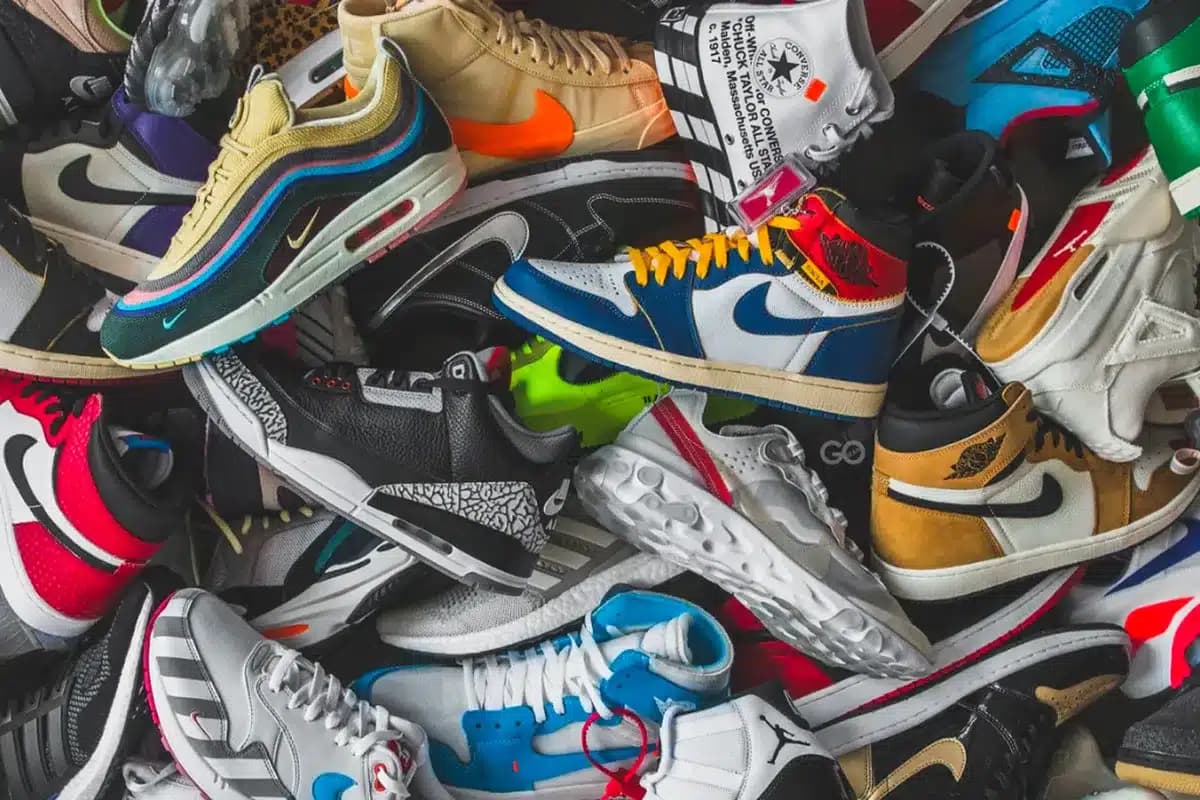 A pile of colorful sneakers with various designs and logos.