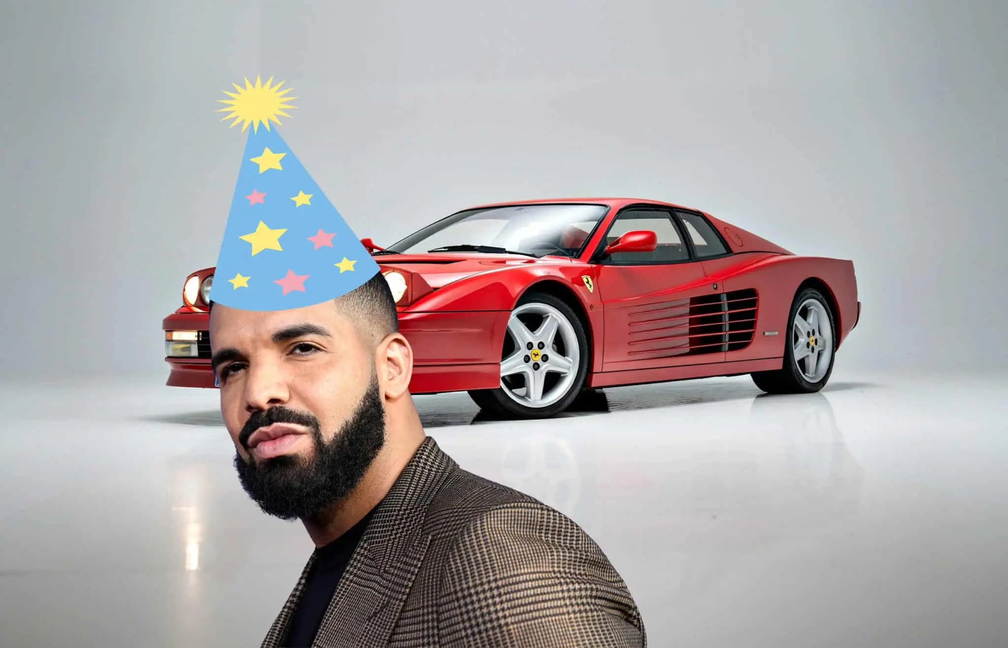 Bearded man wearing a blue star-patterned party hat poses in front of a red Ferrari