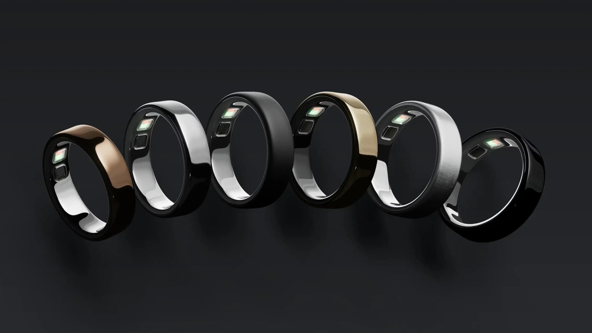 Six glossy fitness-tracking rings in black, silver, gold, and bronze, each with a sensor and button