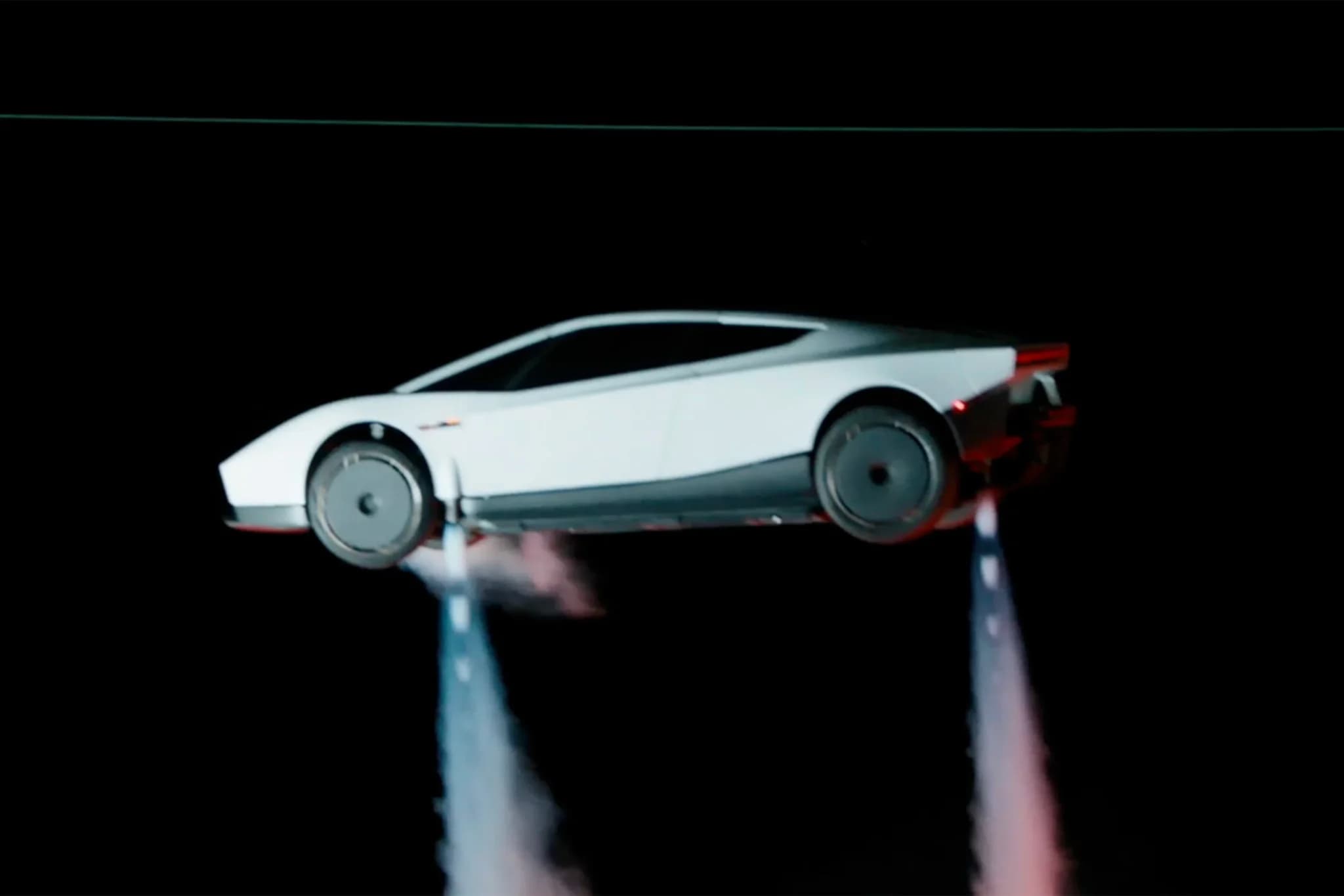 Futuristic white sports car suspended above two columns of smoke against a black background