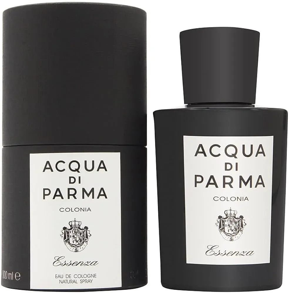A black bottle of Acqua di Parma Colonia Essenza eau de cologne next to its matching cylindrical box, both featuring white labels with the brand name and crest.