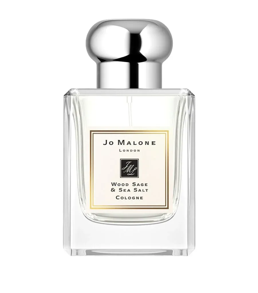 A bottle of Jo Malone London Wood Sage & Sea Salt cologne with a silver cap and a label displaying the product details.