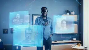 A person wearing virtual reality glasses interacts with multiple floating holographic screens displaying various people in a modern room setting.