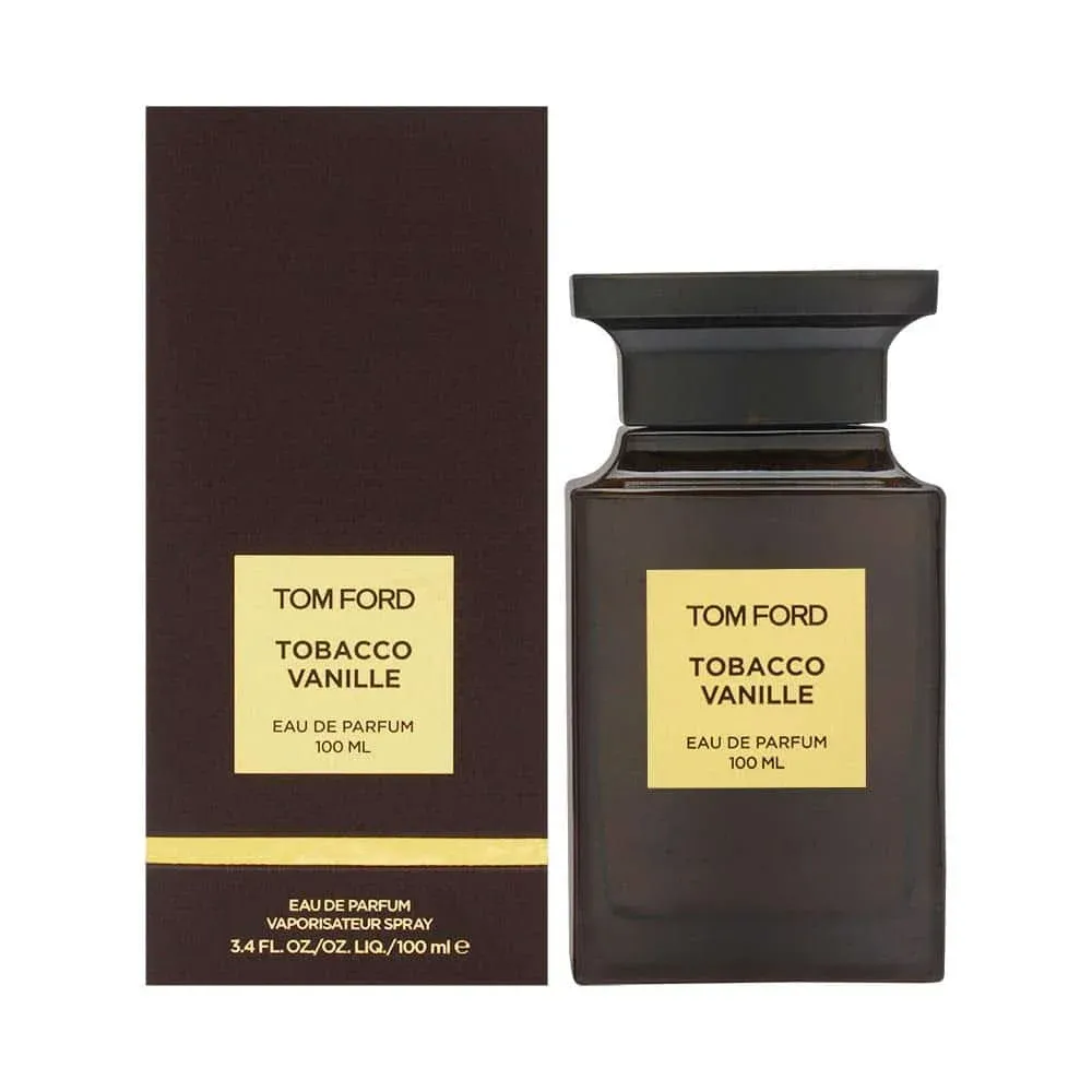 A bottle of Tom Ford Tobacco Vanille Eau de Parfum, 100 ml, next to its box, featuring a dark brown colour with a yellow label.