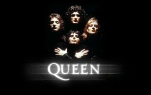 A stylized image of four people in dramatic lighting against a black background, with the word 'Queen' in bold, white letters below.
