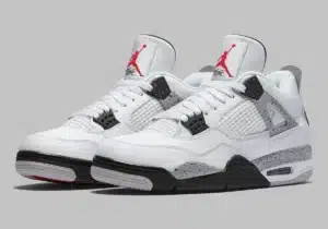 A pair of white and gray athletic shoes with red logos, featuring mesh panels and speckled detailing.