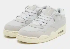 Pair of light gray sneakers with white accents and cream-colored soles, featuring a mix of mesh and suede materials.