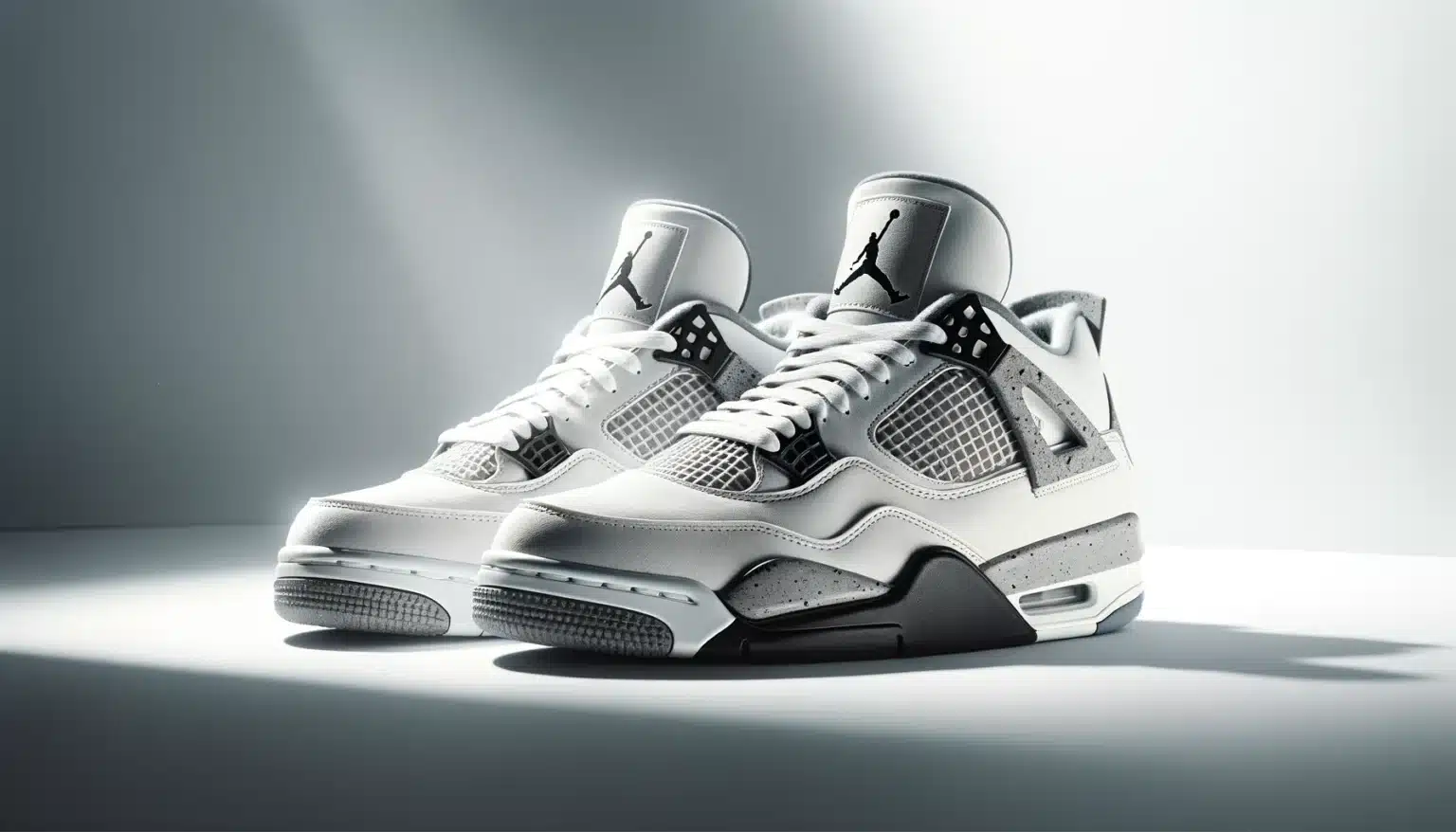 Pair of white and gray athletic sneakers with a black logo on the tongue and a speckled gray midsole, set against a light gray background.