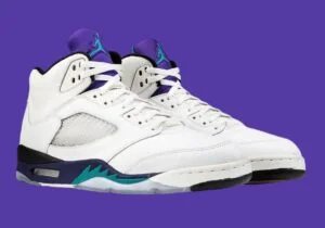 A pair of white high-top sneakers with purple and teal accents, displayed against a solid purple background.