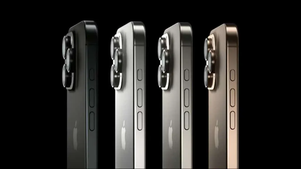 Four smartphones in different shades, featuring a prominent triple-lens camera setup on the back, displayed vertically against a black background.