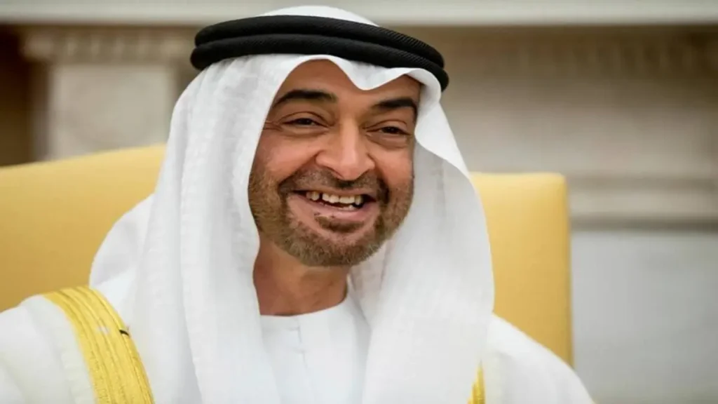 A man wearing traditional Middle Eastern attire, including a white kandura and a ghutra, with a friendly smile.