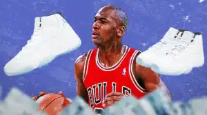 A basketball player in a red jersey dribbling a ball, with two large white sneakers superimposed on either side of him.