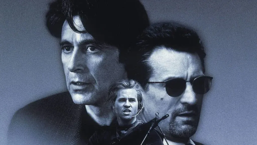 A movie poster featuring three men. One man with dark hair looks intently forward, another wears sunglasses and has a beard, and a third, in the foreground, has blond hair and wears a headset with a microphone.