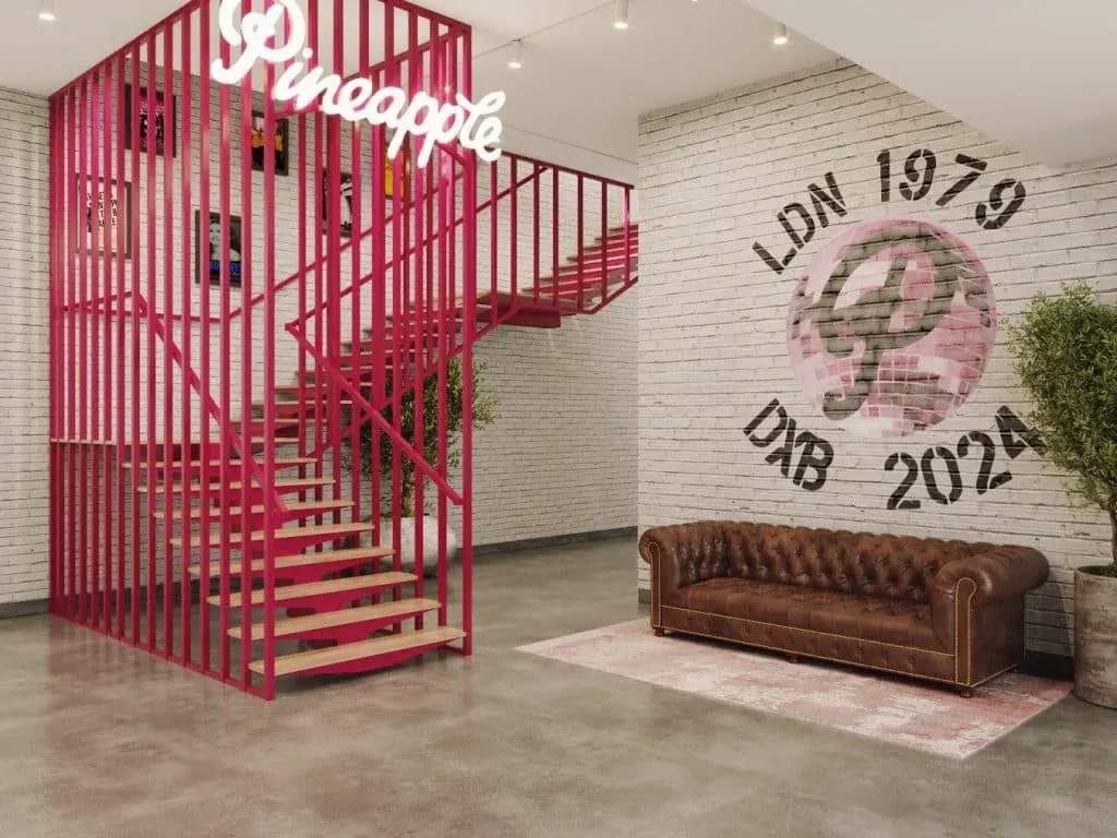 Interior with a modern design featuring a pink staircase with a sign that reads
