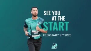 A man running in a race wearing a teal athletic outfit with a race number 3232 and holding a water bottle, accompanied by text reading "See You at the Start, February 9th, 2025" on a teal background.