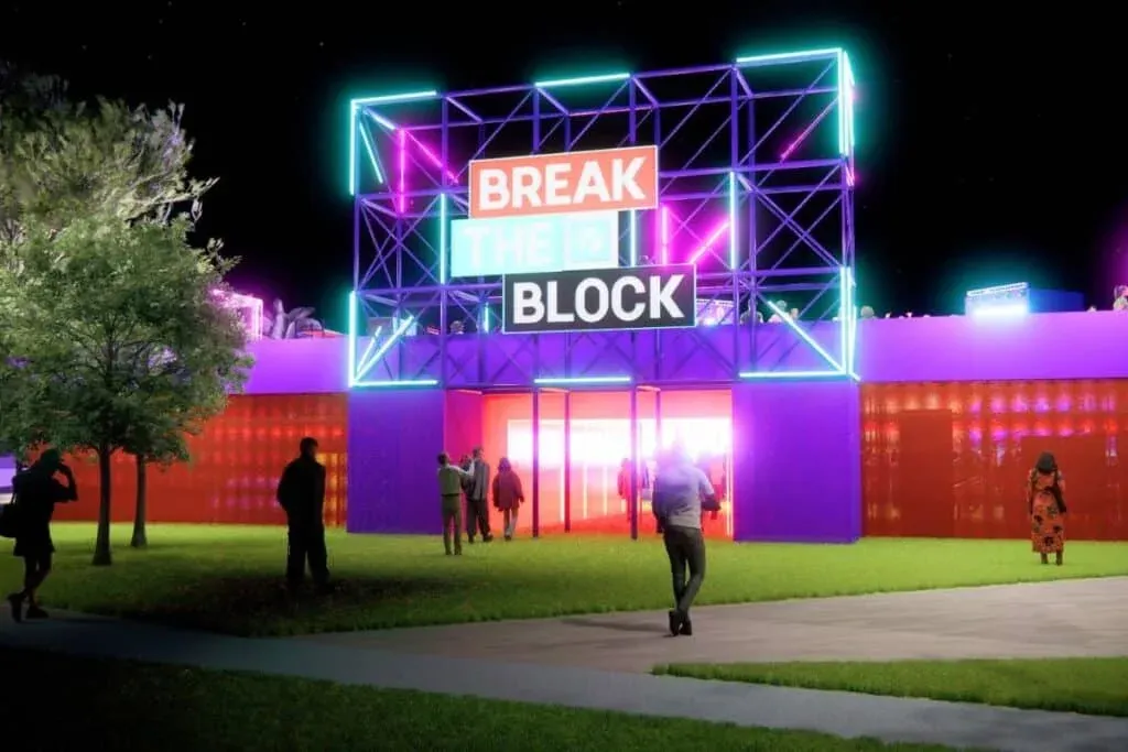 A vibrant, neon-lit building displaying the words