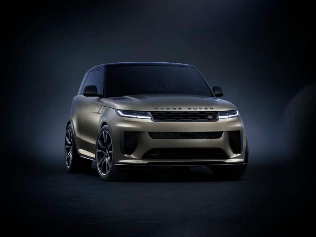A sleek, modern SUV with a metallic finish, featuring sharp headlights and a distinctive grille, shown against a dark gradient background.