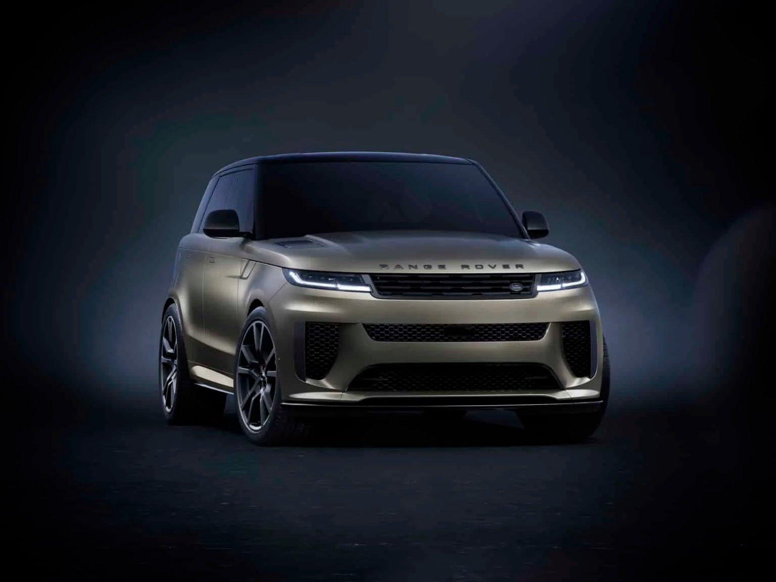 A sleek, modern SUV with a metallic finish, featuring sharp headlights and a distinctive grille, shown against a dark gradient background.