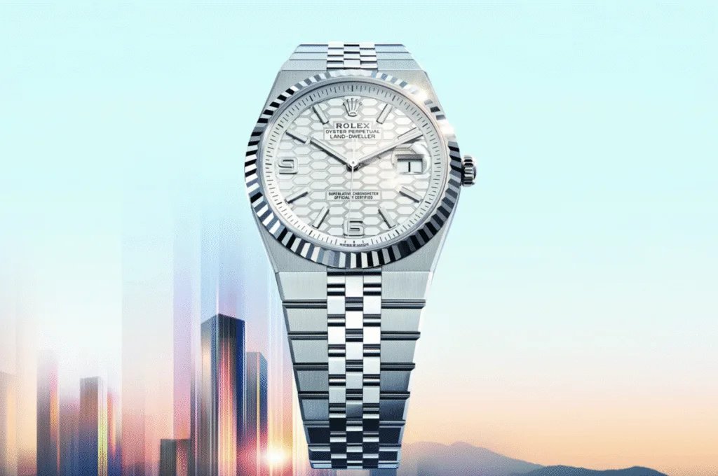 A luxury wristwatch with a silver bracelet and a textured white dial, featuring a cyclops lens for date magnification and styled with modern elements against a softly blurred cityscape at dusk.