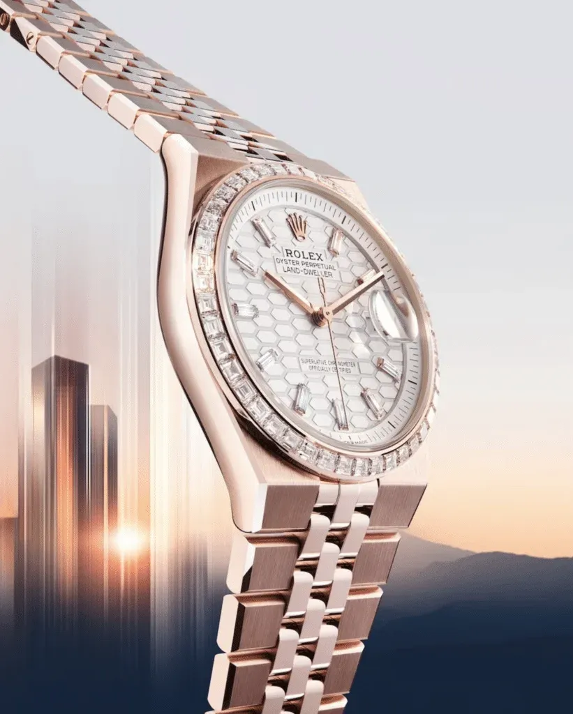 A luxury rose gold watch with a textured dial featuring a honeycomb pattern and a diamond-encrusted bezel, set against a cityscape background at sunset.
