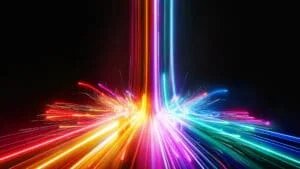 An abstract display of vibrant colored light streaks radiating from a central point, with a dark background enhancing the visual impact of the glowing lines and sparks in red, orange, purple, blue, and green shades.