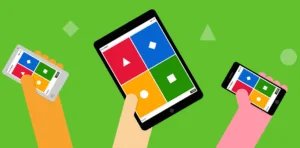 Three hands holding electronic devices displaying a game interface with colorful shapes (red triangle, blue diamond, green square, yellow circle) against a bright green background.