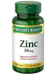 A green bottle of Nature's Bounty Zinc dietary supplement containing 100 caplets, with a label indicating a dosage of 50 mg and a note that it supports immune system function.