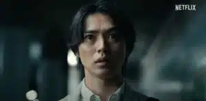Person with long hair looking surprised in a dark setting, with the Netflix logo in the top right corner.