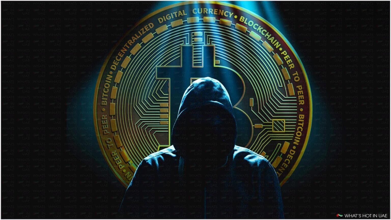 A hooded figure is silhouetted against the background of a large Bitcoin symbol and circuitry, suggestive of digital currency themes.