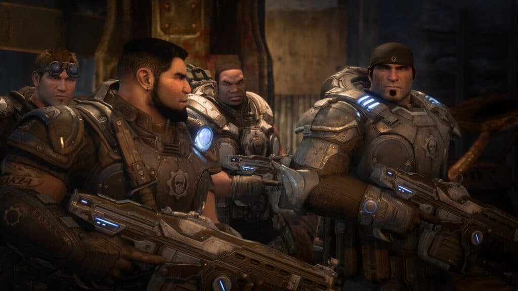 Four heavily armored soldiers with futuristic weapons standing in a dimly lit industrial setting, wearing helmets with blue lights and intense expressions. Upcoming new game releases.