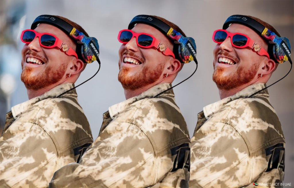 Three identical images of a person with a reddish beard and sunglasses, wearing DJ headphones and a tie-dye jacket, smiling and looking up. Hugel Live at Pure Pacha