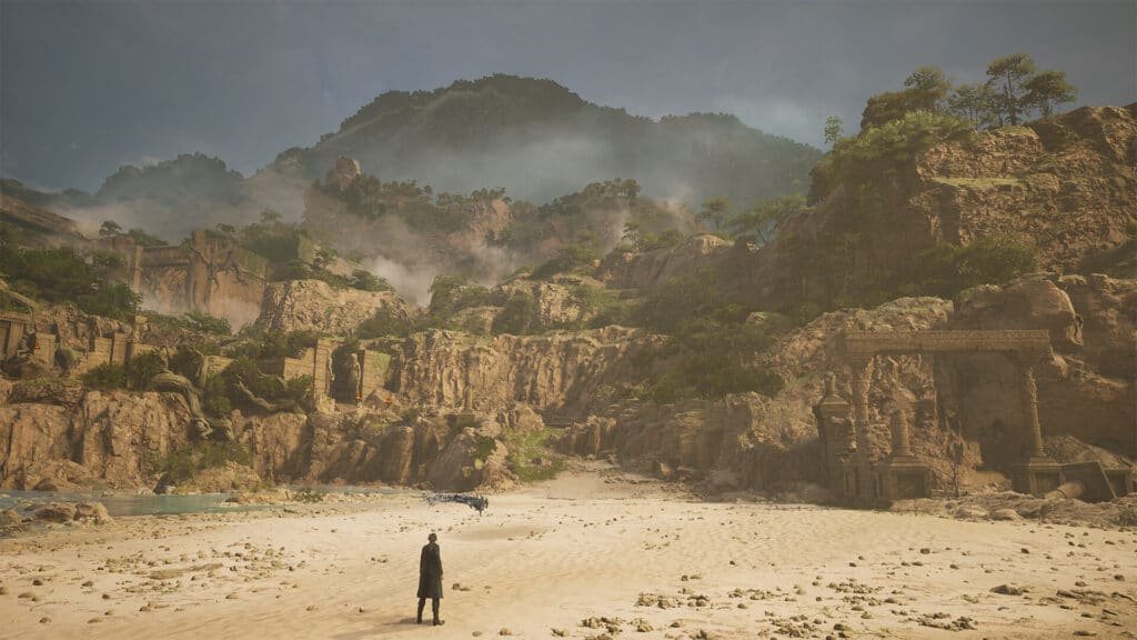 A person stands on a sandy beach surrounded by rocky cliffs with ancient ruins and a statue of a large figure embedded in the hillside. The background features misty mountains and scattered trees. Upcoming new game releases.
