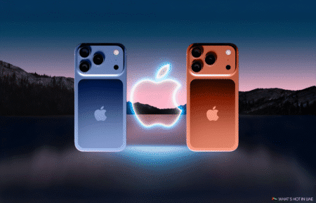 Two iPhone 17 mobile phones, one in blue and the other in orange, are displayed against a mountainous landscape at dusk with a glowing Apple logo between them. This is for the UAE.