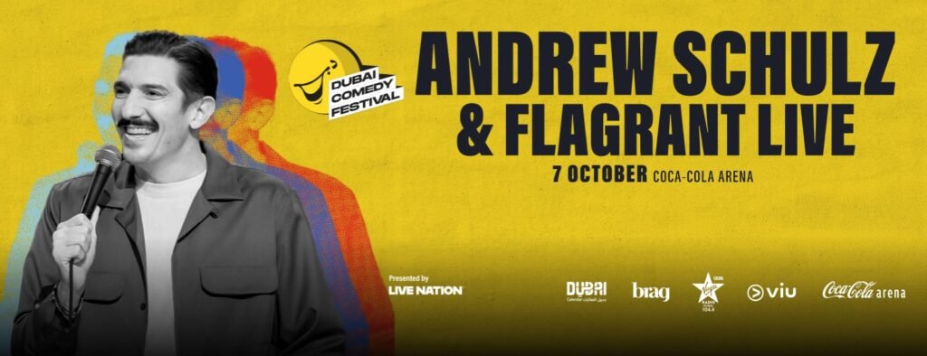 Promotional poster for Andrew Schulz & Flagrant Live at the Dubai Comedy Festival, featuring a black-and-white image of a man with a microphone against a yellow background with colorful overlays, and details about the event on October 7 at Coca-Cola Arena.