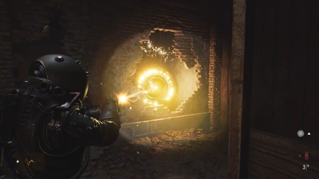A video game scene depicting a character in a black armored suit pointing a glowing weapon towards a round, luminous object embedded in a brick wall, surrounded by a crumbling structure. Cronos: The New Dawn