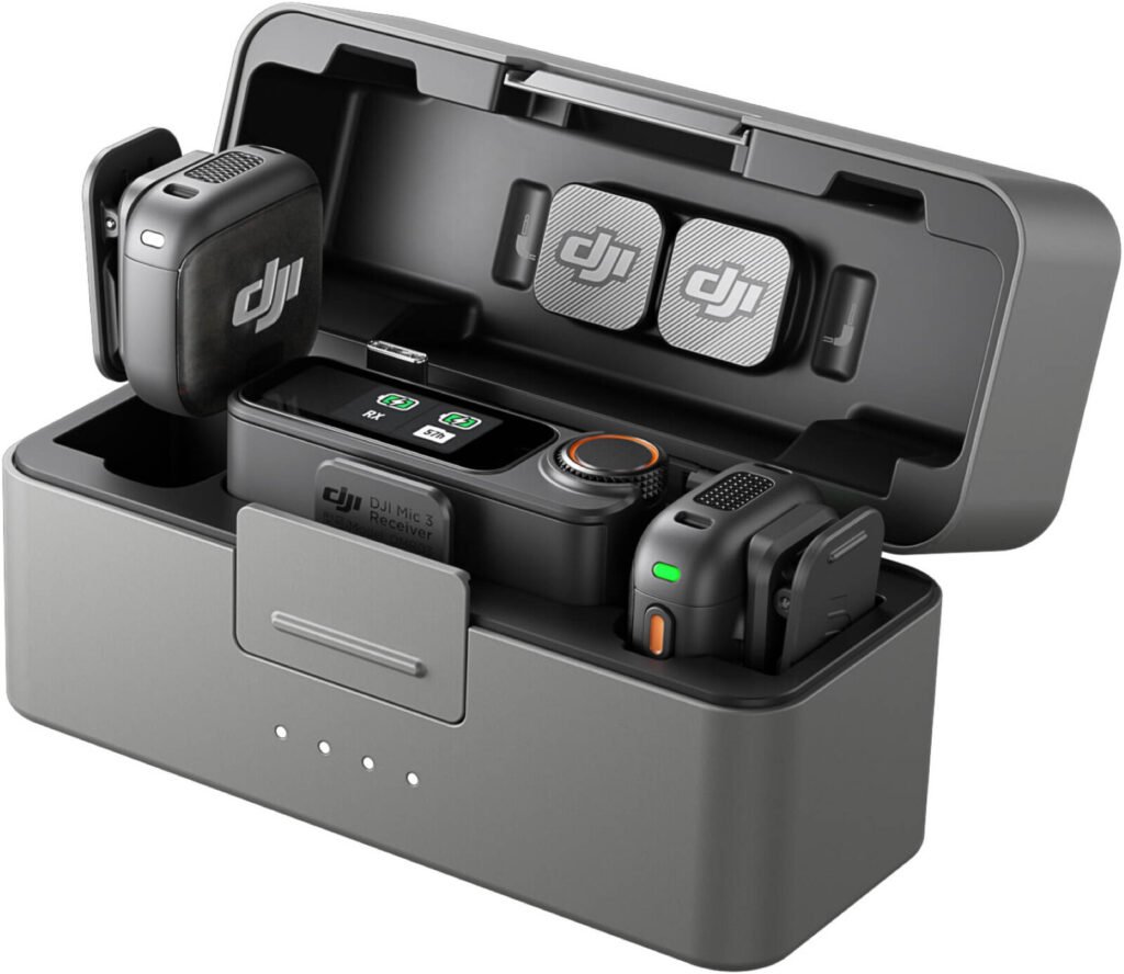 A portable black case containing DJI Mic 3 equipment, including a receiver, two transmitters, and accessories, displayed with the case lid open showing their arrangement and compactness.