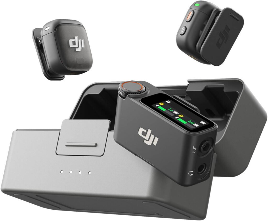 DJI wireless microphone system with two black clip-on microphones and a charging dock with LED indicators and control buttons, featuring the DJI logo on the components.
