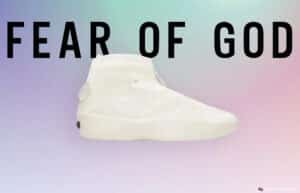 A high-top white shoe from Fear of God displayed on a soft gradient background with the brand name written in large black letters.