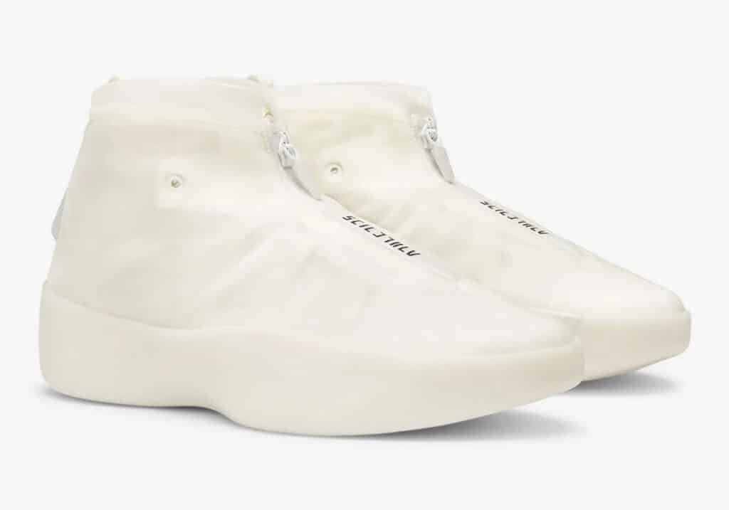 Pair of high-top, white sneakers with a minimalist design, featuring a zipper closure on the side and smooth, thick soles.