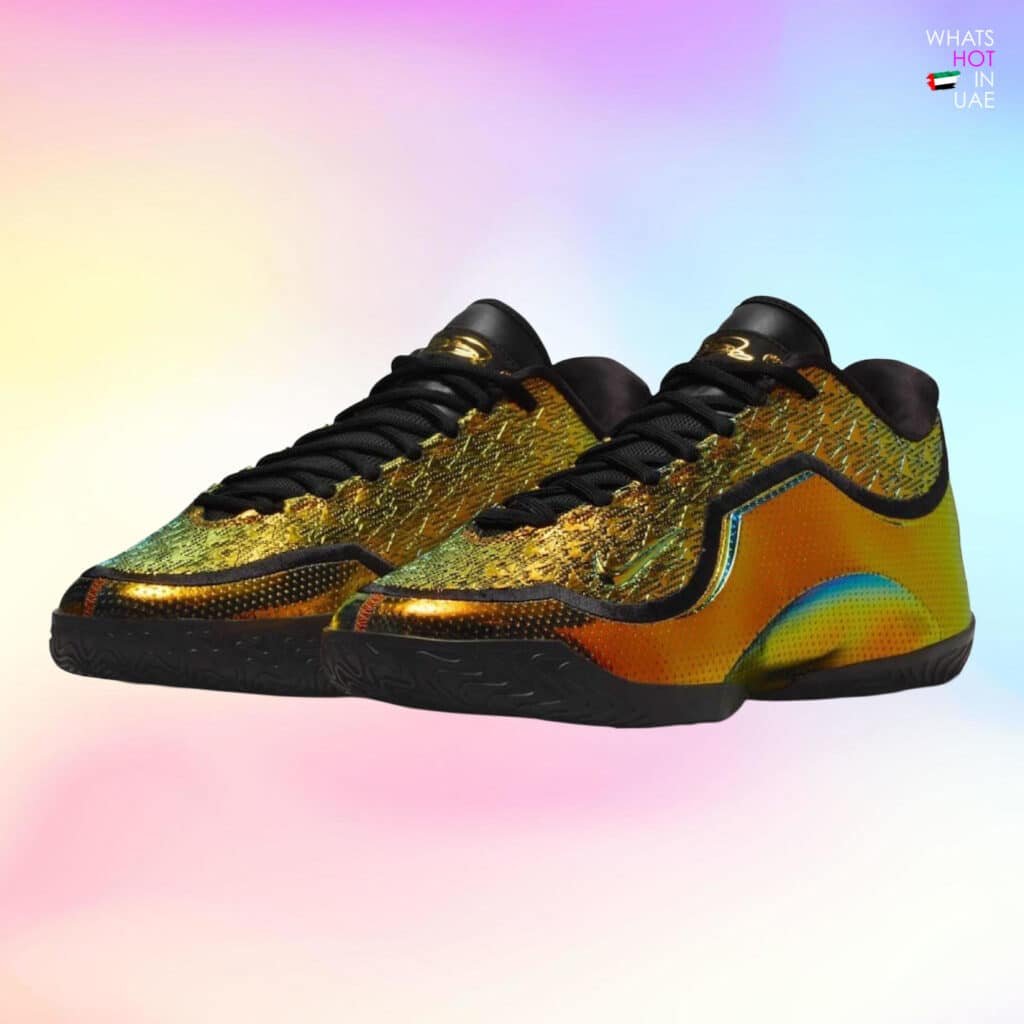 A pair of colorful sneakers with a metallic, iridescent design featuring black laces and soles, set against a gradient pastel background. Nike LeBron 23 “40K Gold”