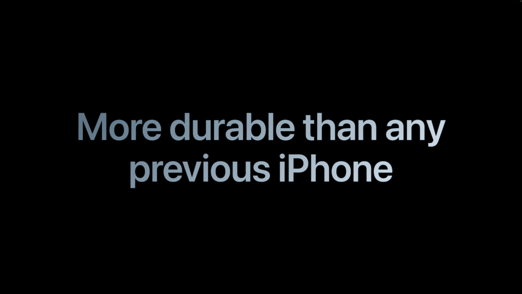 Text displaying "More durable than any previous iPhone" on a black background. iPhone 17