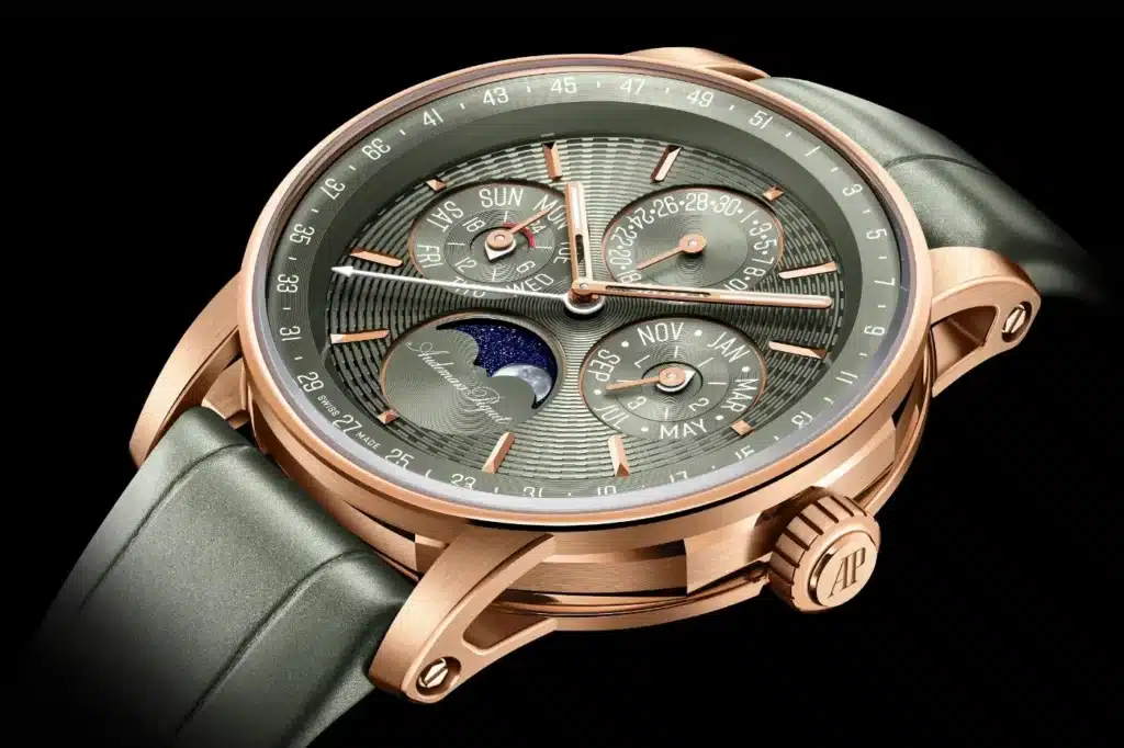 Luxurious gold wristwatch with multiple dials displaying days, dates, and months, featuring moon phase and leather strap, set against a black background. Audemars Piguet - 150th Anniversary Special Editions