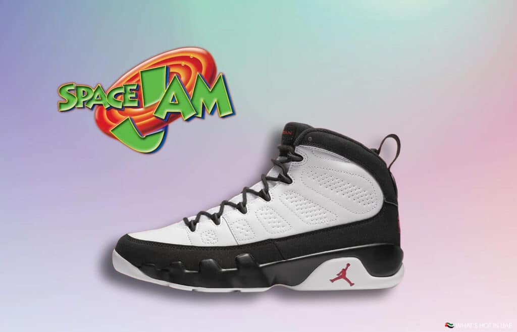 Air Jordan 9 Space Jam sneaker in black and white with the Space Jam logo in the background on a pastel gradient.