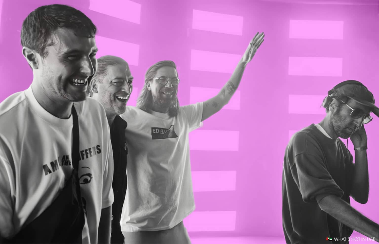 Four men smiling and laughing, with one of them wearing headphones, set against a bright pink background.