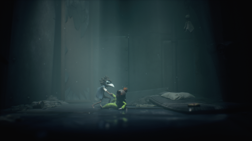 Two stylized characters with exaggerated features share a moment in a dimly lit room, surrounded by debris and a makeshift bed, creating an eerie atmosphere. Little nightmares 3.