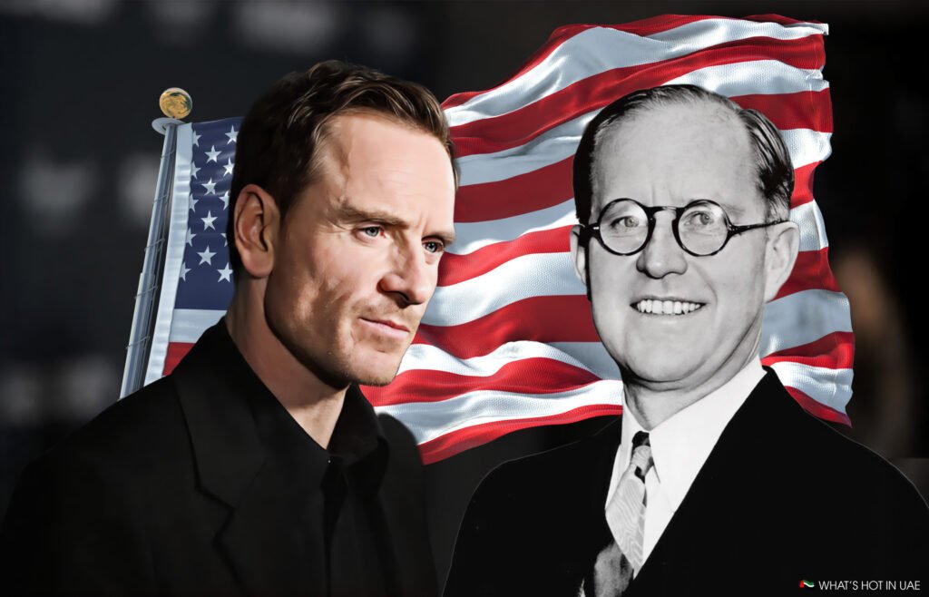 An image showing a Michael Fassbender in a black suit next to a black and white photo of Joseph Kennedy with glasses, both in front of a waving American flag backdrop.