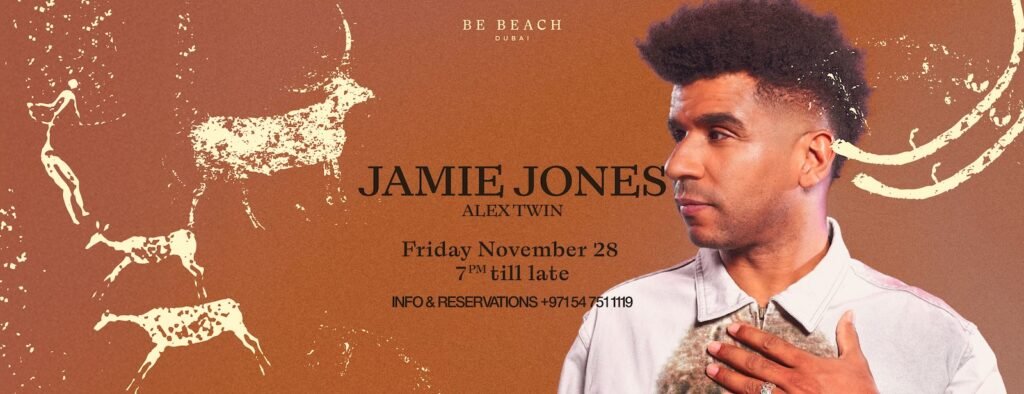 Promotional poster featuring a man with curly hair and a hand on his chest, advertising a music event for Jamie Jones and Alex Twin at Be Beach Dubai on Friday, November 28 at 7 PM. Contact information for reservations is provided.