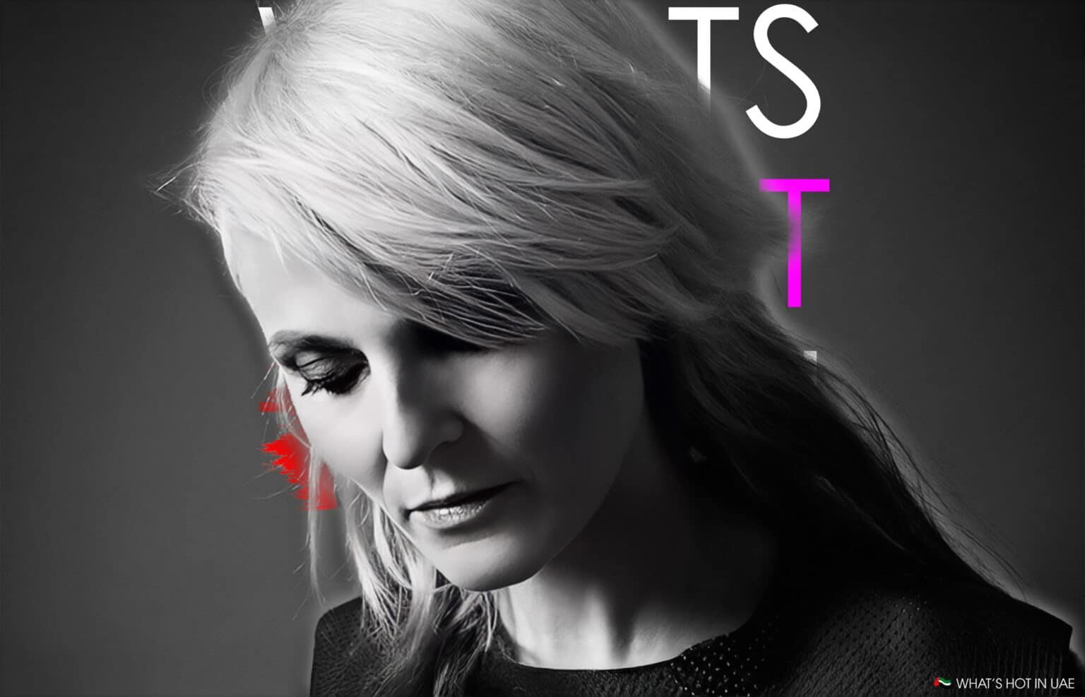 A monochrome portrait of a person with light-colored hair looking downward, featuring red and colorful text elements in the background.